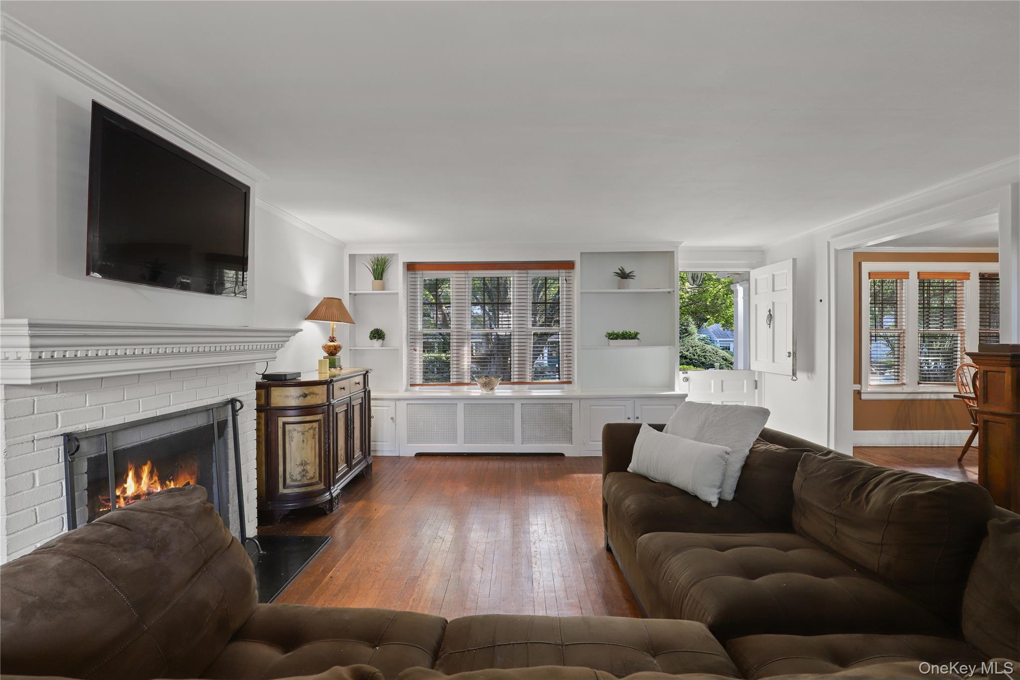 16 Annadale Street Armonk, NY 10504 - Photo 3 of 19 a living room with furniture fireplace and flat screen tv