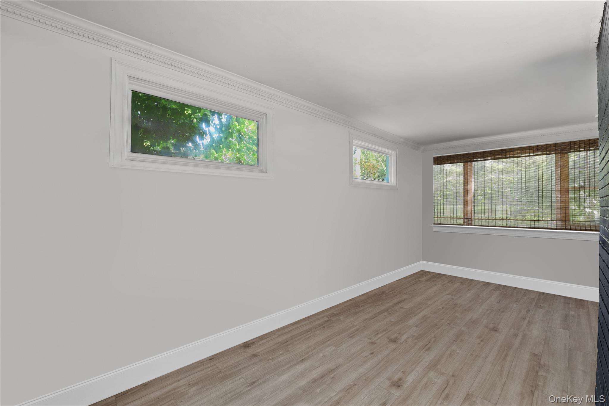16 Annadale Street Armonk, NY 10504 - Photo 9 of 19 a view of an empty room with wooden floor and a window