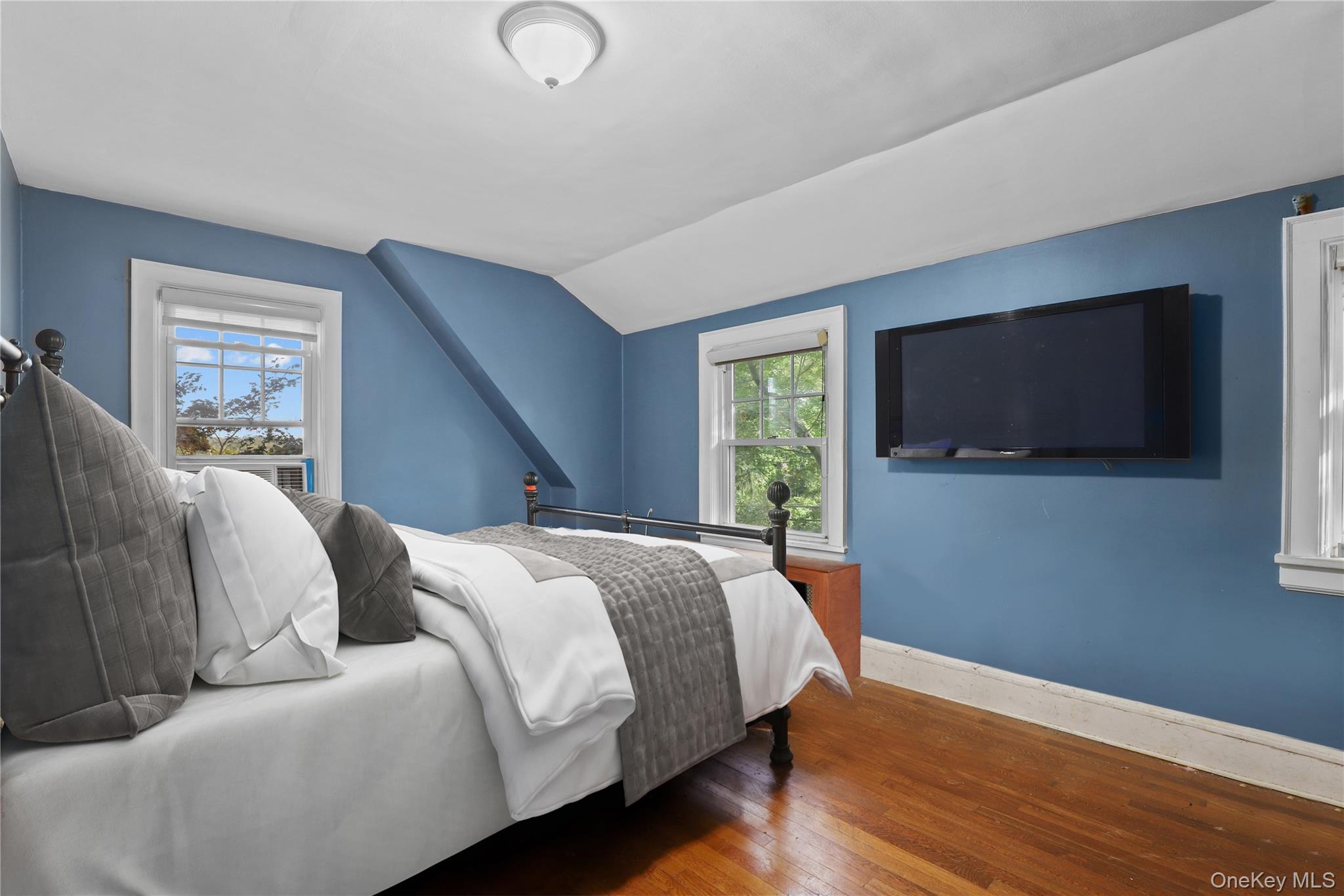 16 Annadale Street Armonk, NY 10504 - Photo 10 of 19 a bedroom with a large bed and a flat screen tv