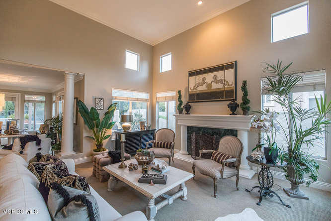 4145 Laurelview Drive Moorpark, CA 93021 - Photo 11 of 55 a living room with furniture a fireplace and potted plants