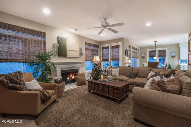 4145 Laurelview Drive Moorpark, CA 93021 - Photo 15 of 55 a living room with furniture a fireplace and a ceiling fan