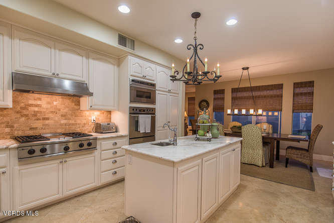 4145 Laurelview Drive Moorpark, CA 93021 - Photo 24 of 55 a kitchen that has a lot of cabinets in it