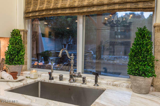 4145 Laurelview Drive Moorpark, CA 93021 - Photo 25 of 55 a kitchen with a sink and potted plant