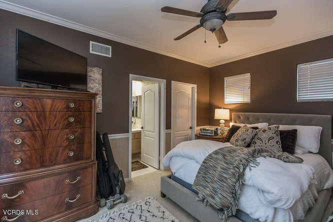 4145 Laurelview Drive Moorpark, CA 93021 - Photo 27 of 55 a bedroom with a bed and a flat screen tv