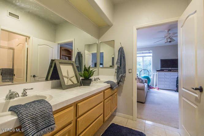 4145 Laurelview Drive Moorpark, CA 93021 - Photo 32 of 55 a bathroom with a sink and a mirror