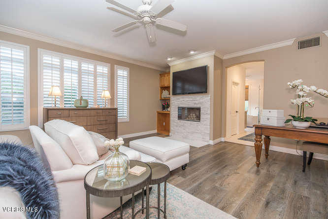 4145 Laurelview Drive Moorpark, CA 93021 - Photo 37 of 55 a living room with furniture a fireplace and a flat screen tv