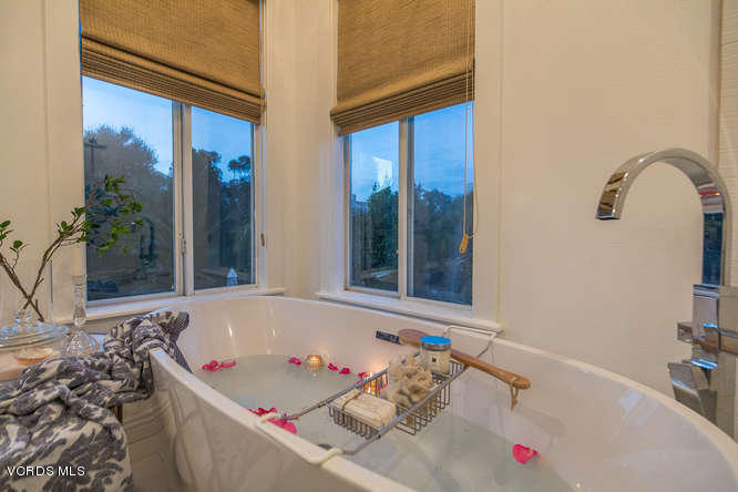 4145 Laurelview Drive Moorpark, CA 93021 - Photo 41 of 55 a bath tub sitting next to a white sink