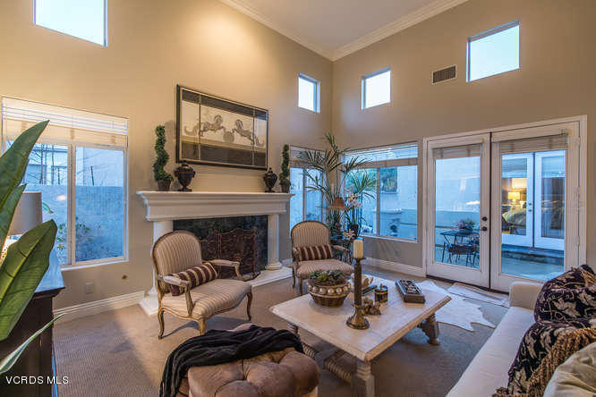 4145 Laurelview Drive Moorpark, CA 93021 - Photo 8 of 55 a living room with furniture a flat screen tv and a floor to ceiling window