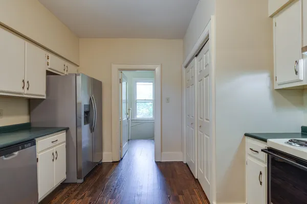 a kitchen with stainless steel appliances a refrigerator and a stove top oven