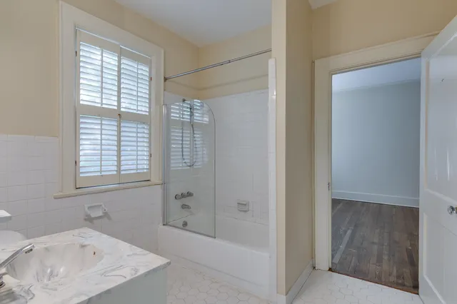 a bathroom with a bathtub and a sink