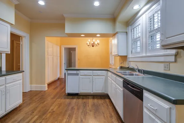 a kitchen with a sink and cabinets