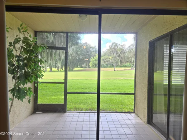 a view of a porch with a big yard
