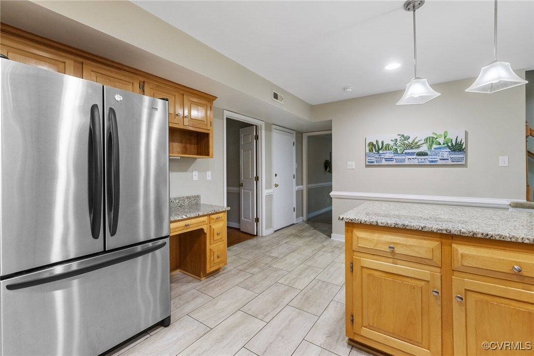 15210 Powell Grove Road Midlothian, VA 23112 - Photo 11 of 36 a kitchen with stainless steel appliances granite countertop a refrigerator and a sink