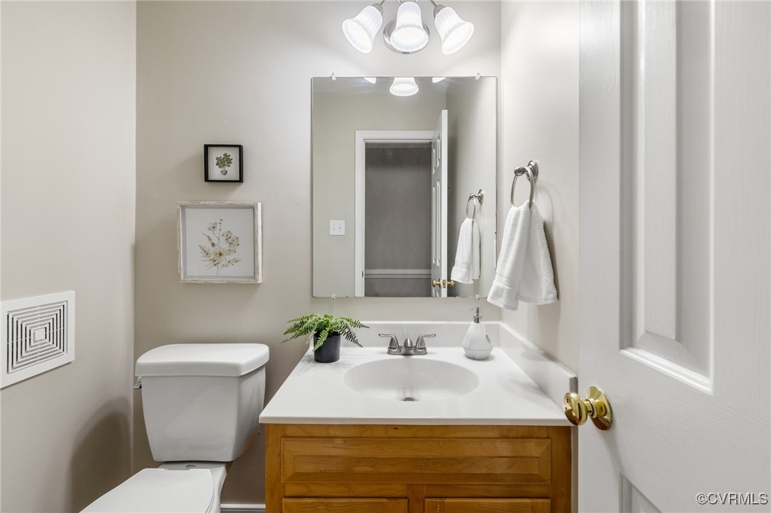 15210 Powell Grove Road Midlothian, VA 23112 - Photo 20 of 36 a bathroom with a sink vanity mirror and toilet