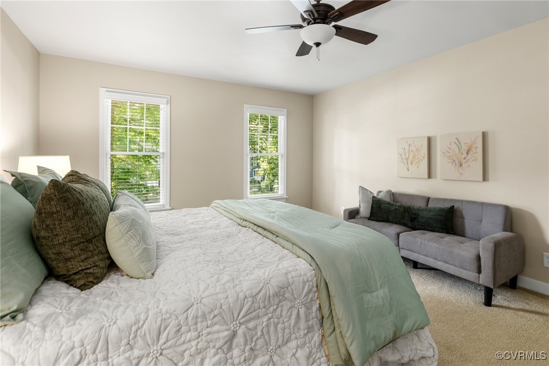15210 Powell Grove Road Midlothian, VA 23112 - Photo 28 of 36 a large bed sitting in a bedroom next to a window