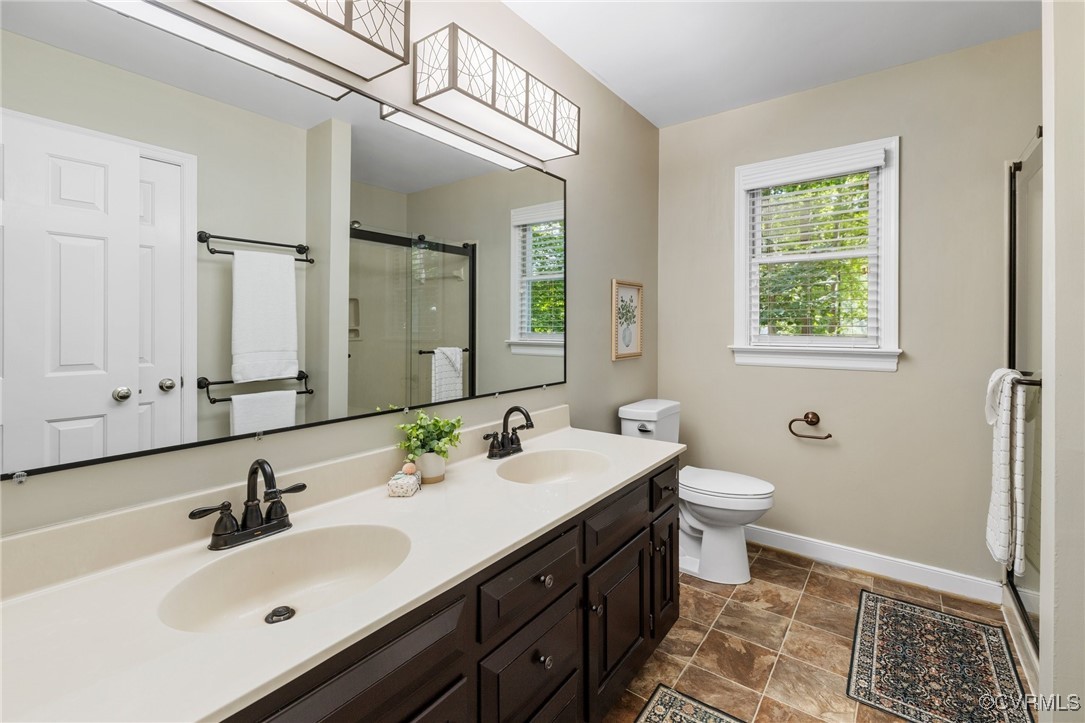 15210 Powell Grove Road Midlothian, VA 23112 - Photo 29 of 36 a bathroom with a sink and a mirror