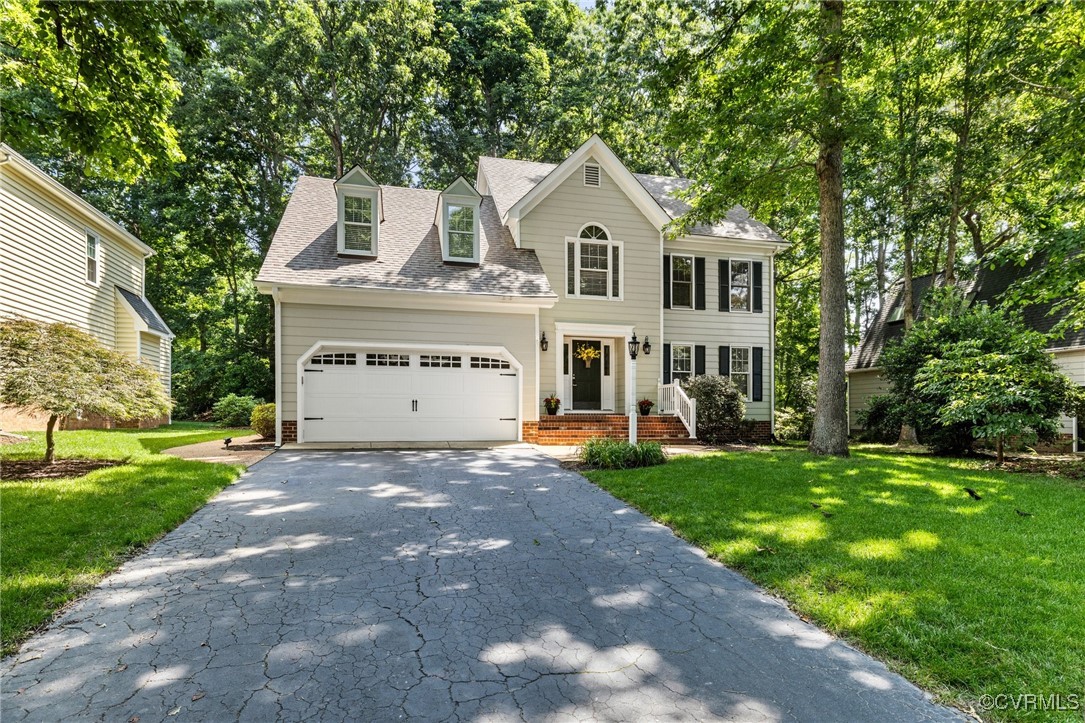 15210 Powell Grove Road Midlothian, VA 23112 - Photo 33 of 36 a view of white house with a big yard and large trees