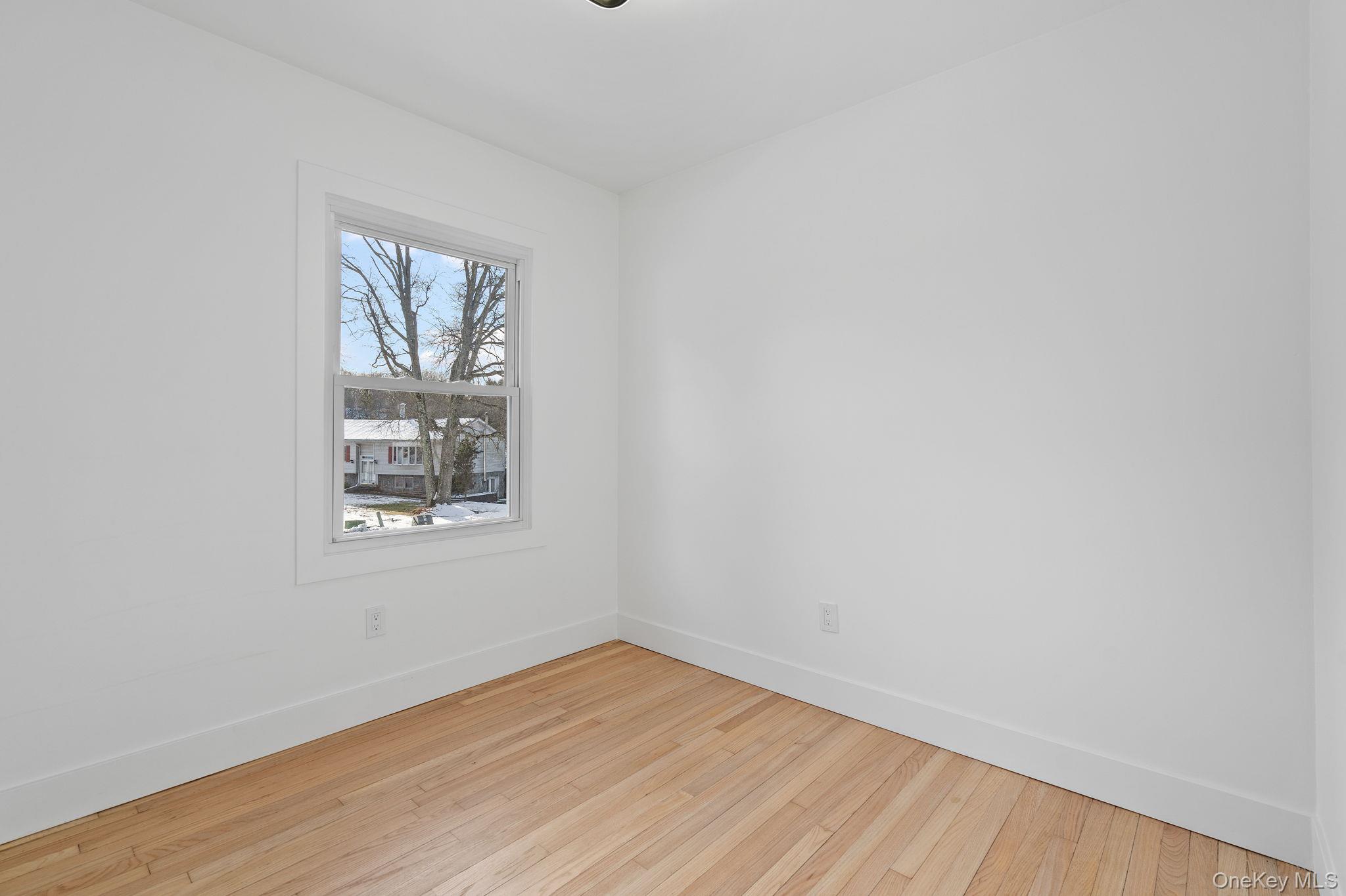 52 Rudolph Road Modena, NY 12548 - Photo 19 of 49 Spare room featuring baseboards and hardwood / wood-style floors