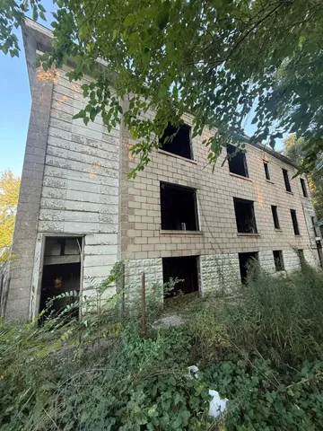a view of house with yard and an outdoor space
