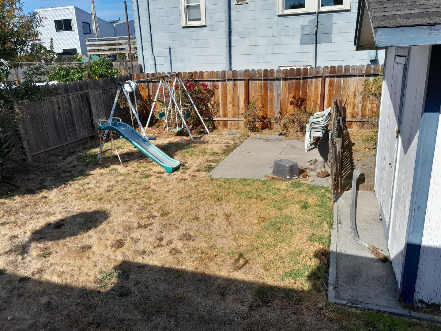 1211 Russell Street Berkeley, CA 94702 - Photo 9 of 15 a view of a backyard with a wooden fence
