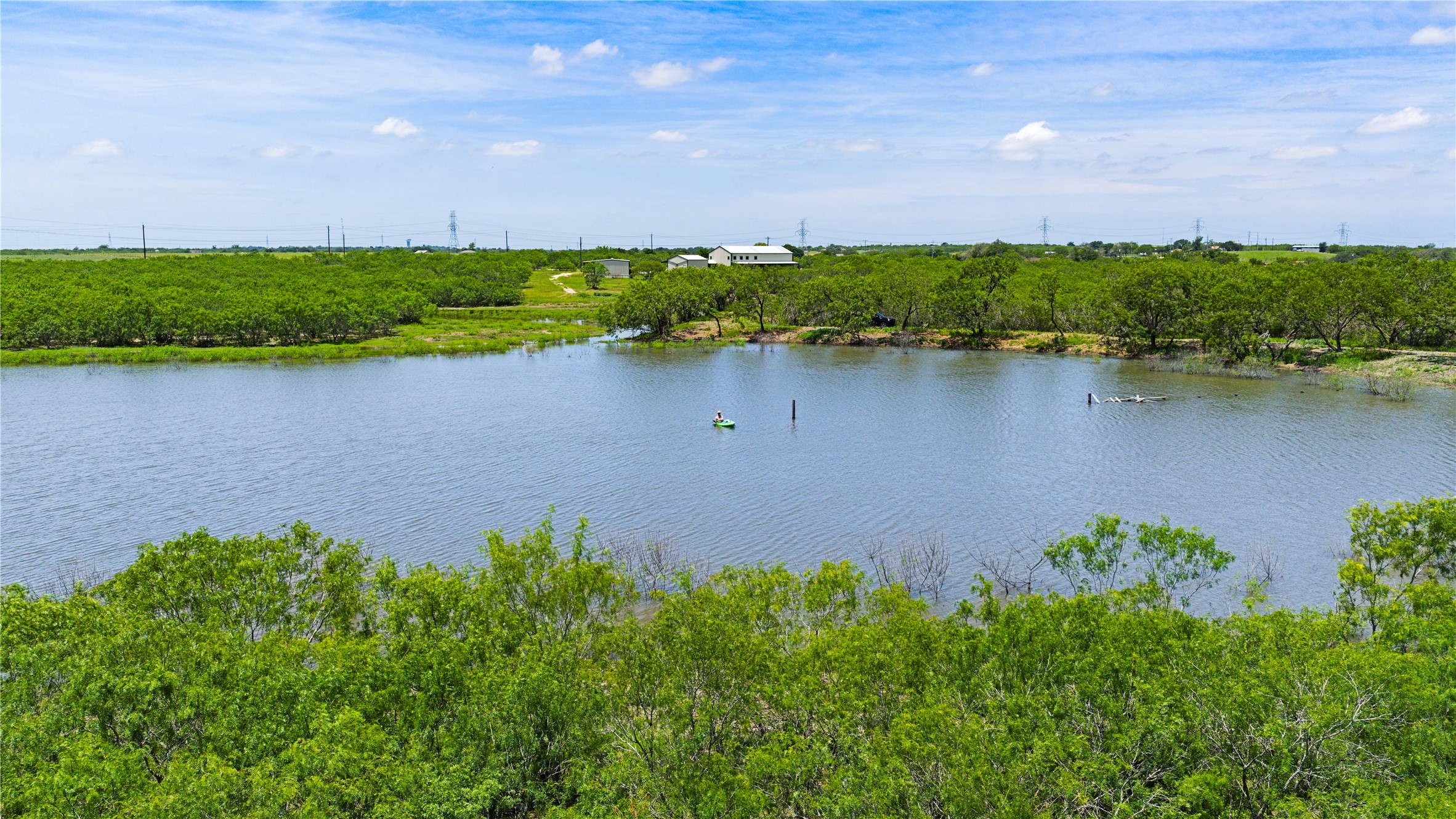 1293 Pioneer Road Seguin, TX 78155 - Photo 2 of 40 A tranquil lake view property, perfect for outdoor enthusiasts, offering privacy and natural beauty.