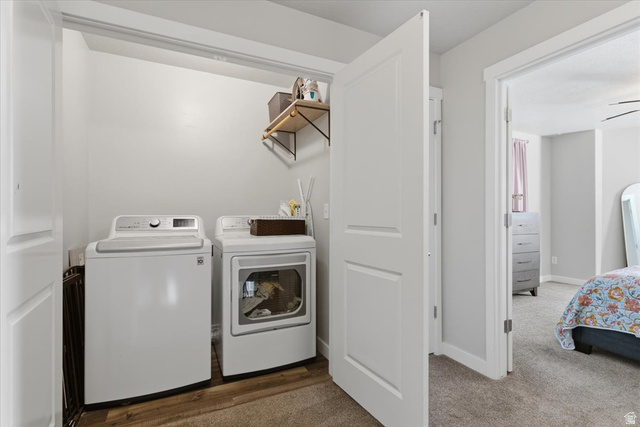 370 West Knights Lane Layton, UT 84041 - Photo 19 of 31 Dedicated laundry closet with wood-finish flooring and an overhead wall shelf