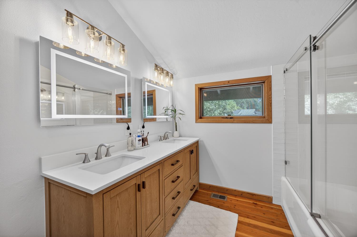3940 Bannister Road Fair Oaks, CA 95628 - Photo 27 of 84 a bathroom with a sink a mirror and a shower