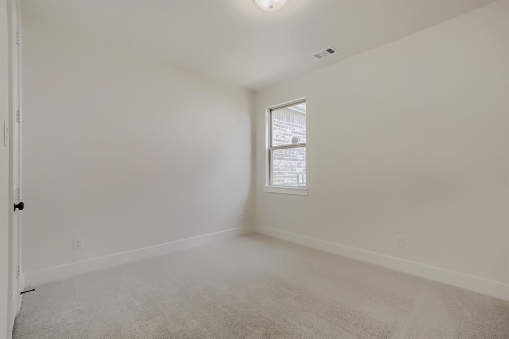 824 Stone Grv Road Lavon, TX 75166 - Photo 11 of 26 Neutral-toned room featuring a single window and recessed lighting