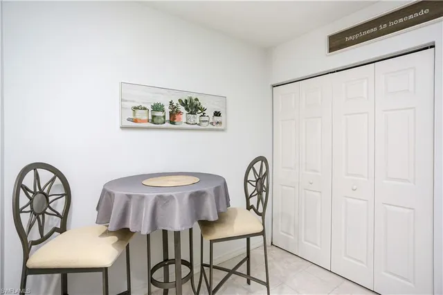 a view of a dining room that has a table and a chair