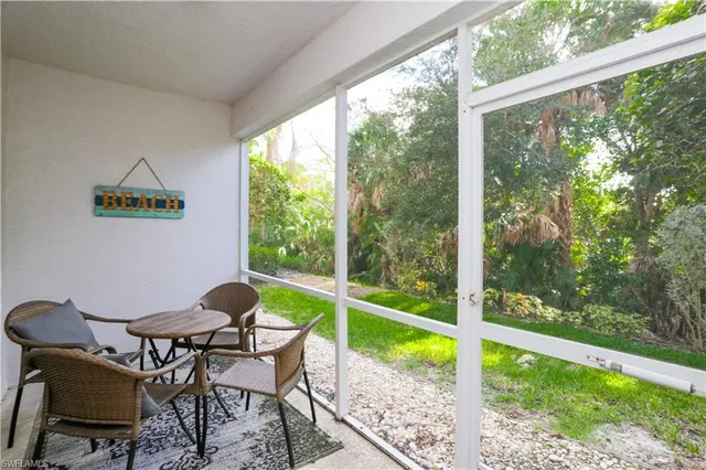 a patio with table and chairs