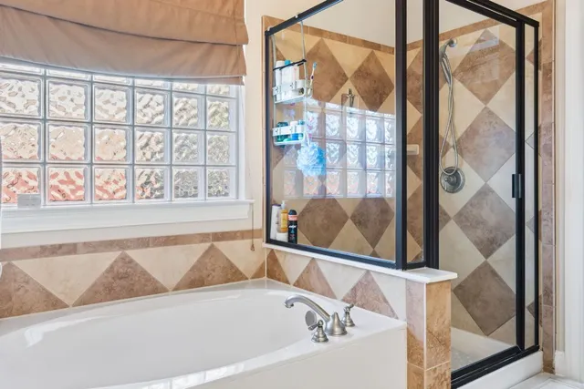 a bath tub sitting next to a window