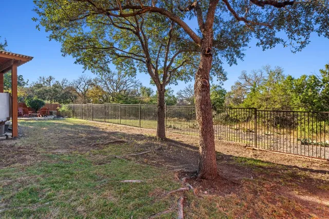 an aerial view of a house with yard swimming pool and outdoor seating