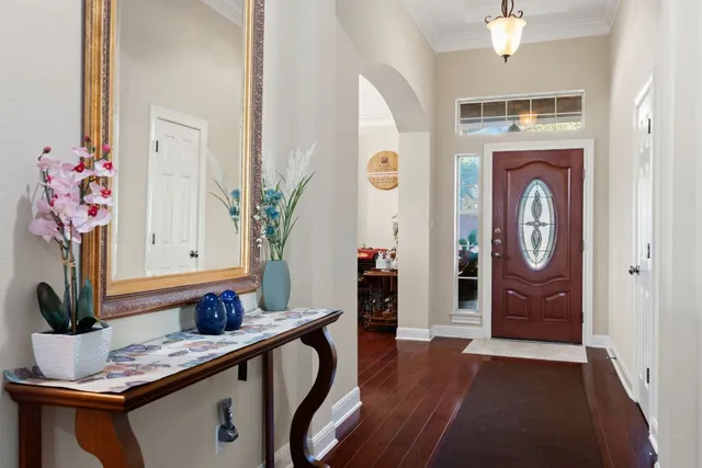 a view of hall way with furniture