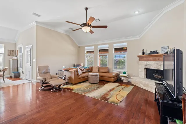 a living room with furniture and a fireplace