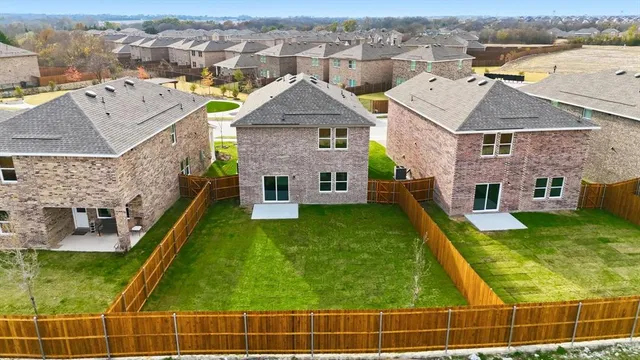 a view of yard with wooden fence