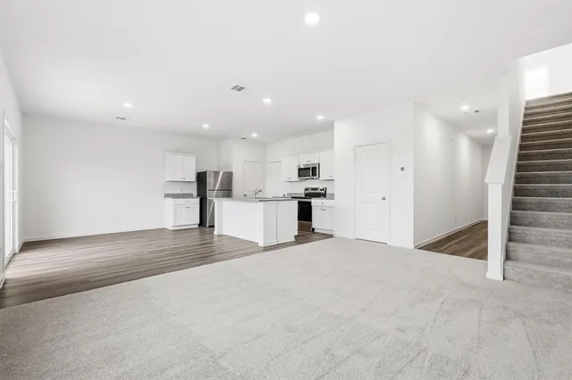 an aerial view of residential houses with outdoor space and swimming pool