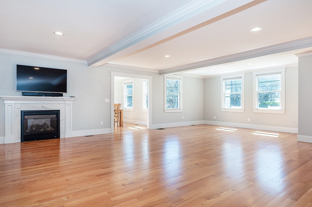 501 Point Road Marion, MA 02738 - Photo 11 of 42 a view of a livingroom with a fireplace a window and a fireplace