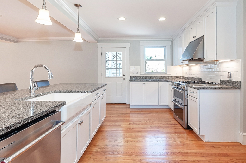 501 Point Road Marion, MA 02738 - Photo 16 of 42 a large kitchen with granite countertop a stove top oven sink and cabinets