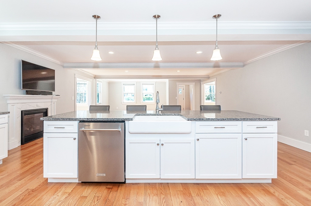 501 Point Road Marion, MA 02738 - Photo 17 of 42 a kitchen with stainless steel appliances granite countertop a stove a sink and a chandelier