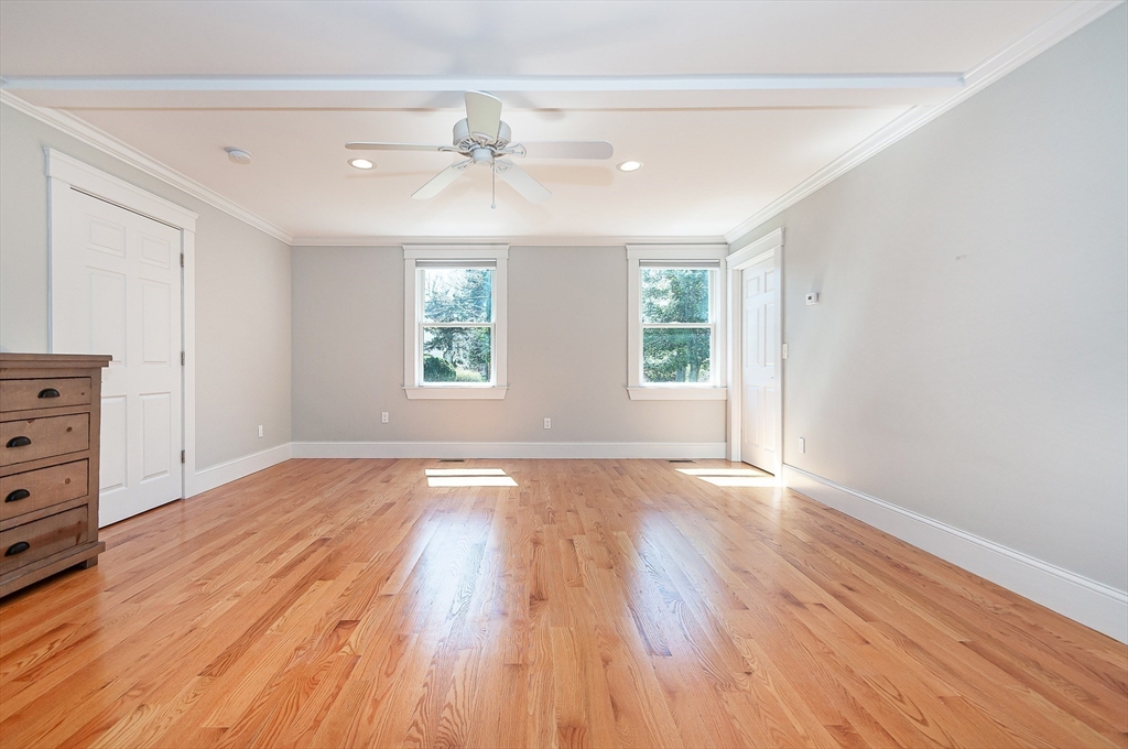 501 Point Road Marion, MA 02738 - Photo 20 of 42 an empty room with wooden floor and windows