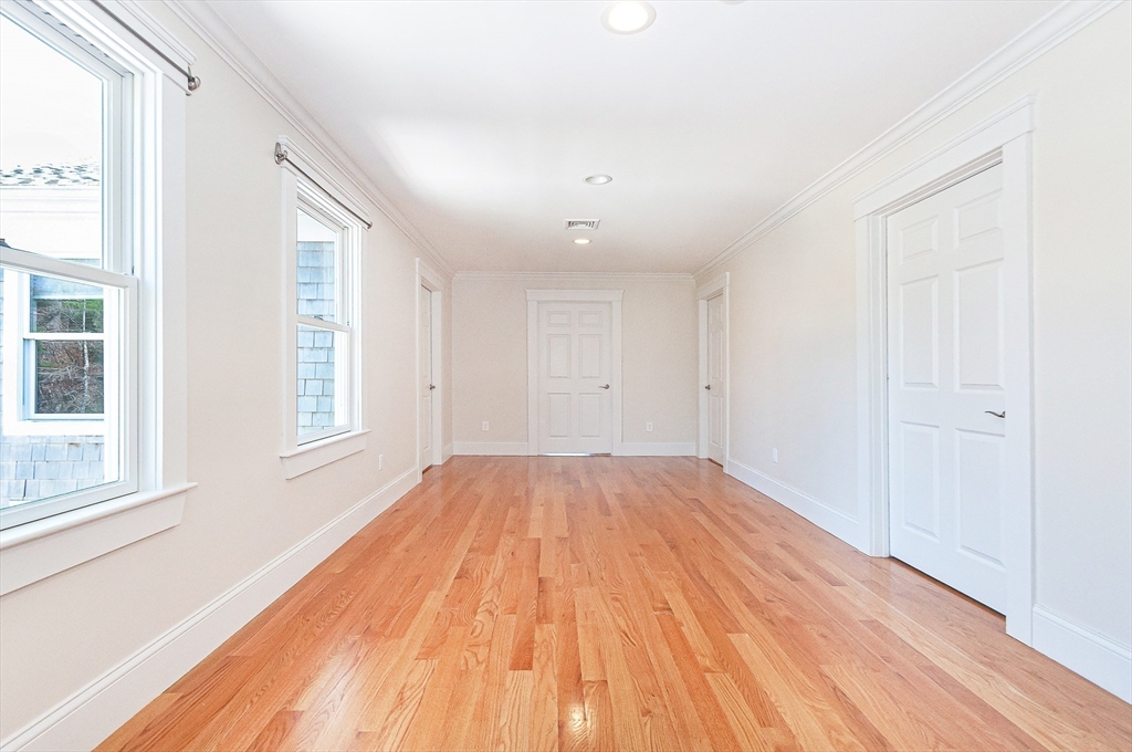 501 Point Road Marion, MA 02738 - Photo 27 of 42 a view of empty room with wooden floor and fan