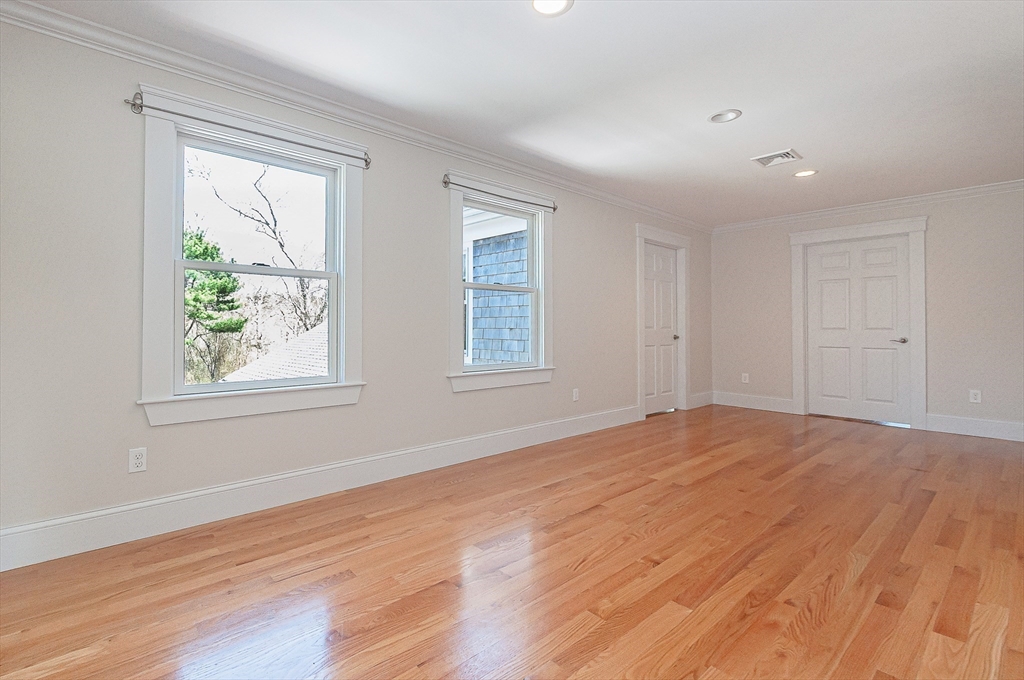 501 Point Road Marion, MA 02738 - Photo 28 of 42 a view of an empty room with wooden floor and a window