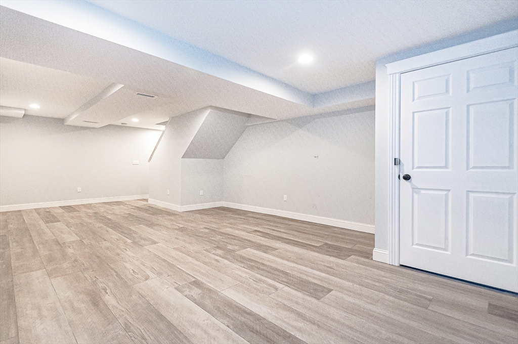 501 Point Road Marion, MA 02738 - Photo 31 of 42 an empty room with wooden floor and windows