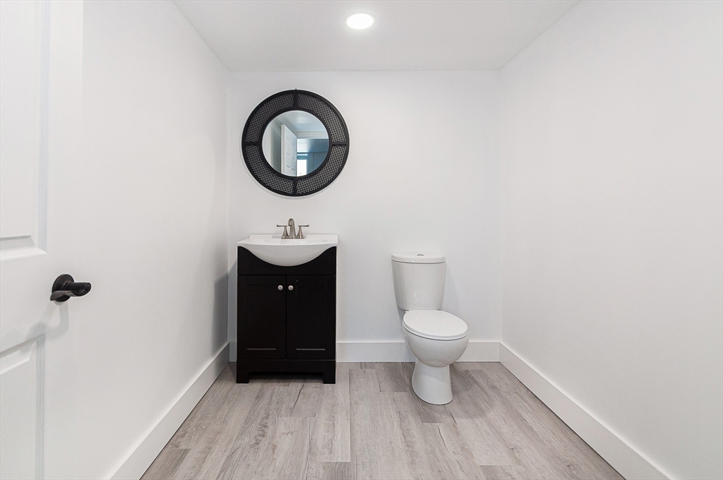 501 Point Road Marion, MA 02738 - Photo 34 of 42 a bathroom with a toilet a sink and a mirror