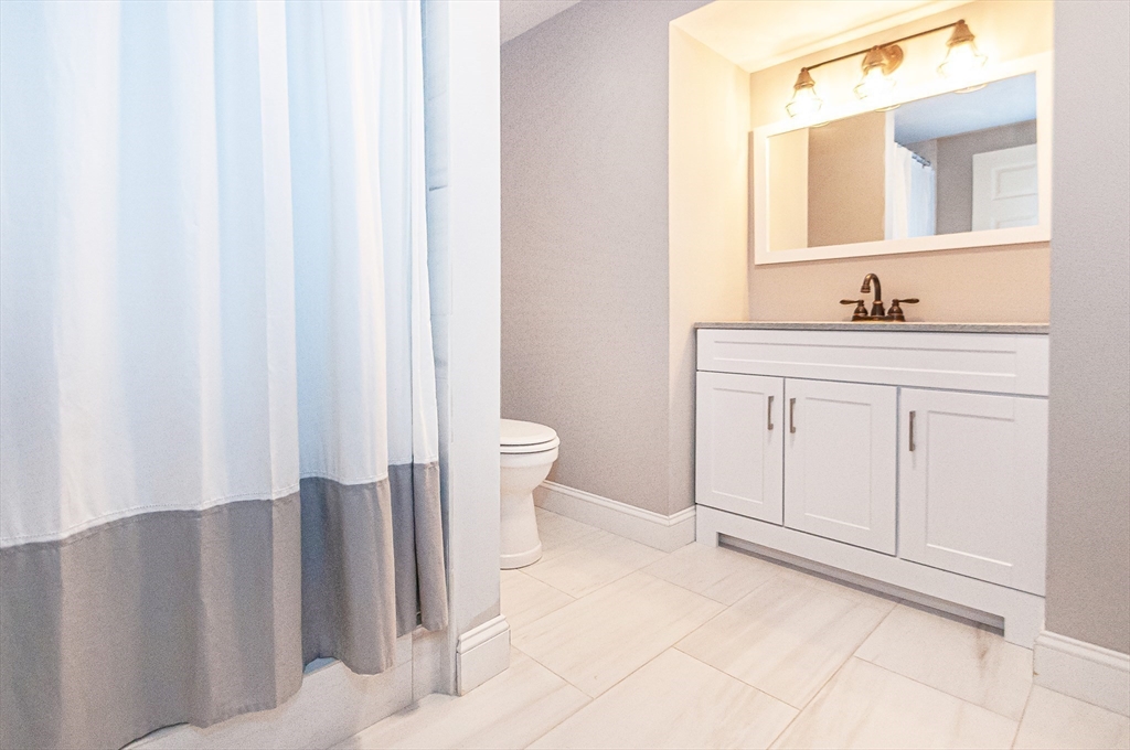 501 Point Road Marion, MA 02738 - Photo 35 of 42 a bathroom with a sink and a mirror