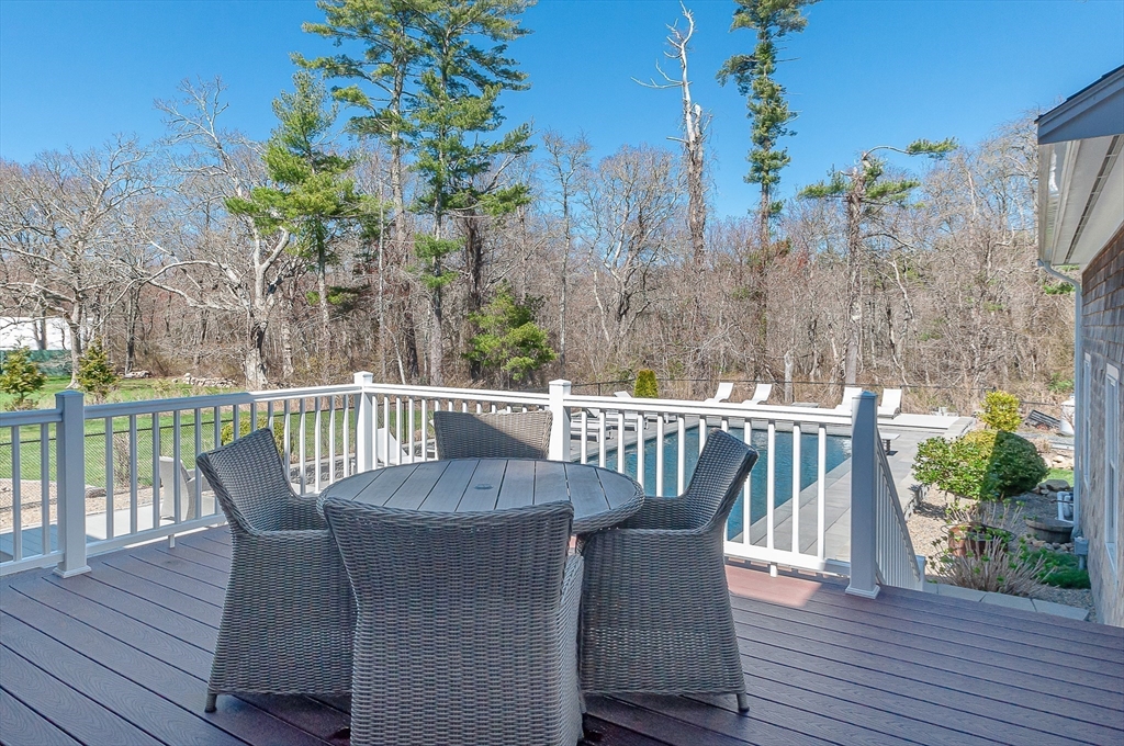 501 Point Road Marion, MA 02738 - Photo 39 of 42 a balcony with wooden floor table and chairs