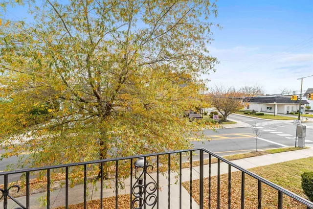 a view of a balcony with an outdoor seating