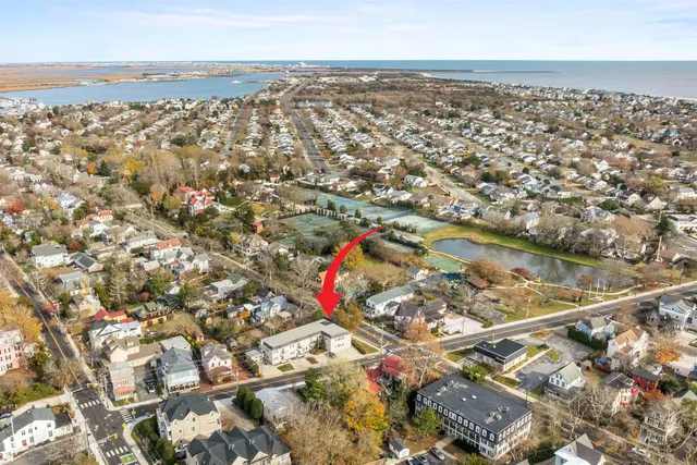 an aerial view of residential houses with outdoor space