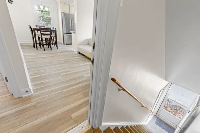 a view of a hallway with furniture and front door