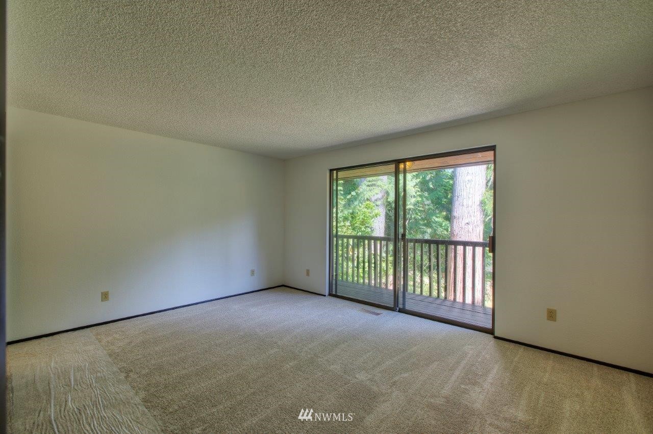 22004 Southeast Bain Road Renton, WA 98058 - Photo 11 of 27 a view of an empty room with a balcony